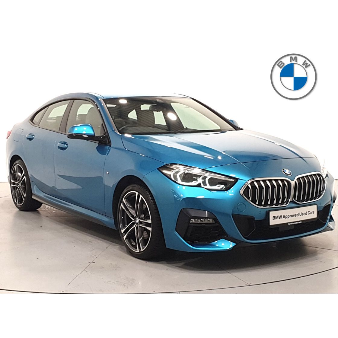 a photograph of a blue BMW car following quality control. good quality used car photography